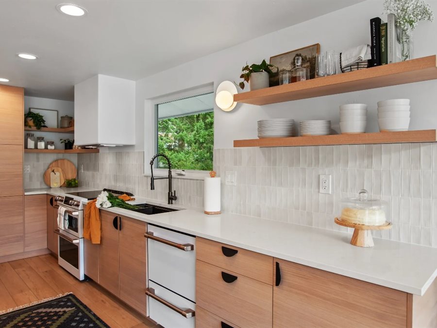 Kitchen designer reviewing cabinet layout and design details